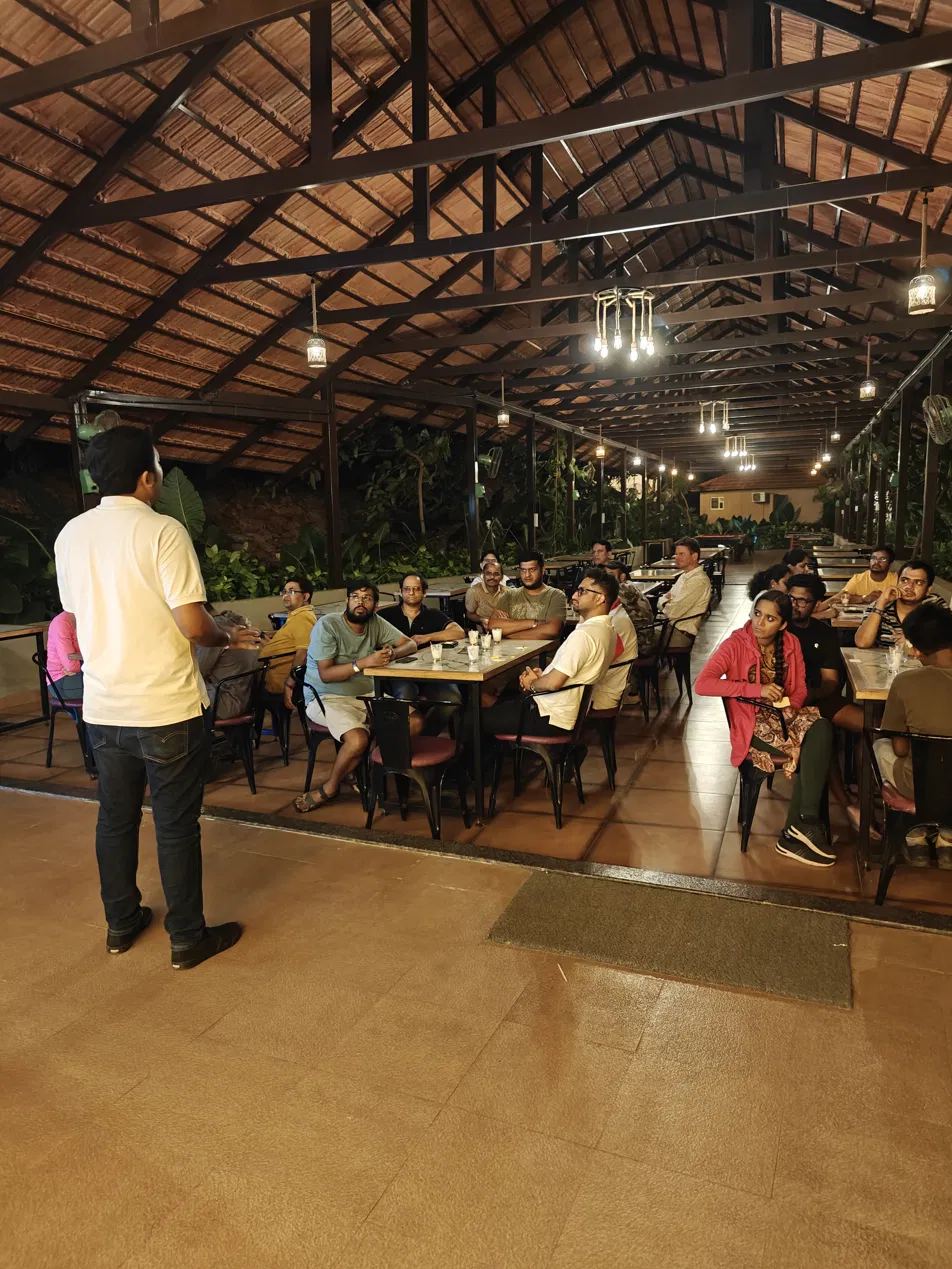 A facilitator briefing a team indoors