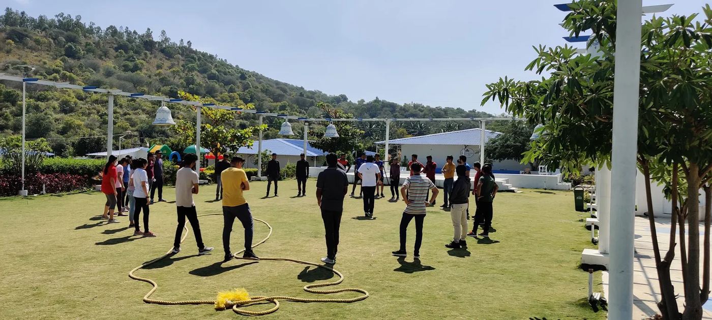 A team activity on a lawn with rope